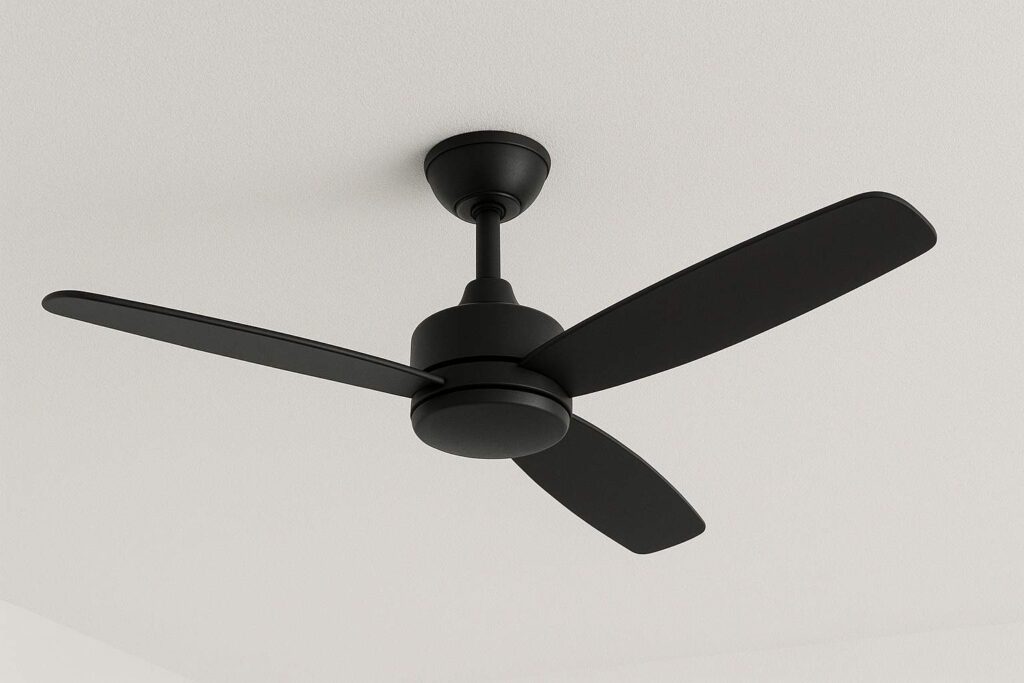 Sleek black ceiling fan with three blades, designed for modern interiors and energy-efficient cooling.