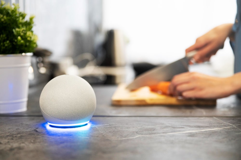 Smart speaker with AI voice assistant on kitchen counter controlling home devices